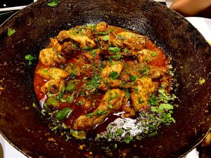 Sizzling,Chicken,Karhai,In,A,Traditional,Utensil.,Golden brown,Chicken,In